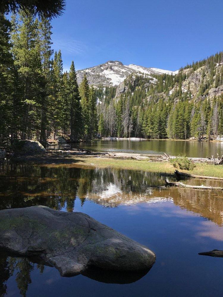 The ultimate Colorado hiking guide for awesome trails with mountains, waterfalls, and epic photography views for beginners to experts to get some of that mountain magic and wanderlust exploring America. Summer pictures and ideas for day trips near Denver, Boulder, Estes Park, Rocky Mountain National Park, and Colorado Springs. Nature, adventure, and beautiful places guaranteed. Because getting outdoors is one of the best things to do in Denver and fun vacation ideas with kids. #colorado #hikes 